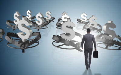 A man in a suit holding a briefcase walks towards several bear traps with dollar signs, symbolizing financial hazards. The background is a gradient blue, creating a sense of depth and contrast between opportunities and pitfalls in the image.