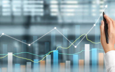 A person holds a pen, drawing an upward-trending line on a transparent screen with various colored bar and line graphs in the background, symbolizing business property maintenance and growth through diligent data analysis.