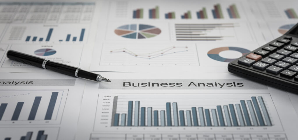 A desk with business analysis documents displaying various charts and graphs, alongside a pen and calculator, suggests financial or data analysis activities. Among the papers, a focus on cost segregation study highlights potential tax savings strategies for enhanced fiscal planning.