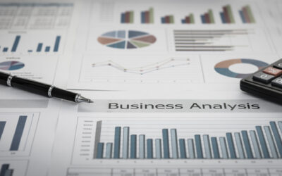 A desk with business analysis documents displaying various charts and graphs, alongside a pen and calculator, suggests financial or data analysis activities. Among the papers, a focus on cost segregation study highlights potential tax savings strategies for enhanced fiscal planning.