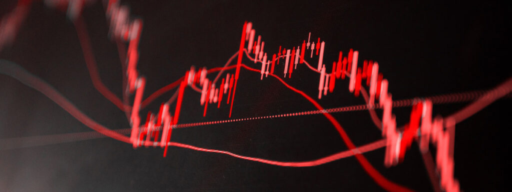A fluctuating red line graph on a black background, depicting financial market trends or stock performance with peaks and troughs, suggests volatility and changes over time—a crucial tool for estate tax planning.