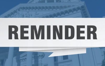 the word REMINDER in all capital letters against a background photo of the US Capital Building