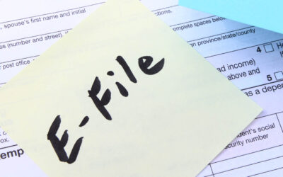 photo of tax return with post-it note on which is written