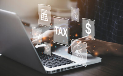 A person types on a laptop surrounded by floating tax-related icons, such as a calendar and document, illustrating financial organization and online tax management. Proposed regulations for §267 and §707 could influence transactions with partnerships in this digital landscape.